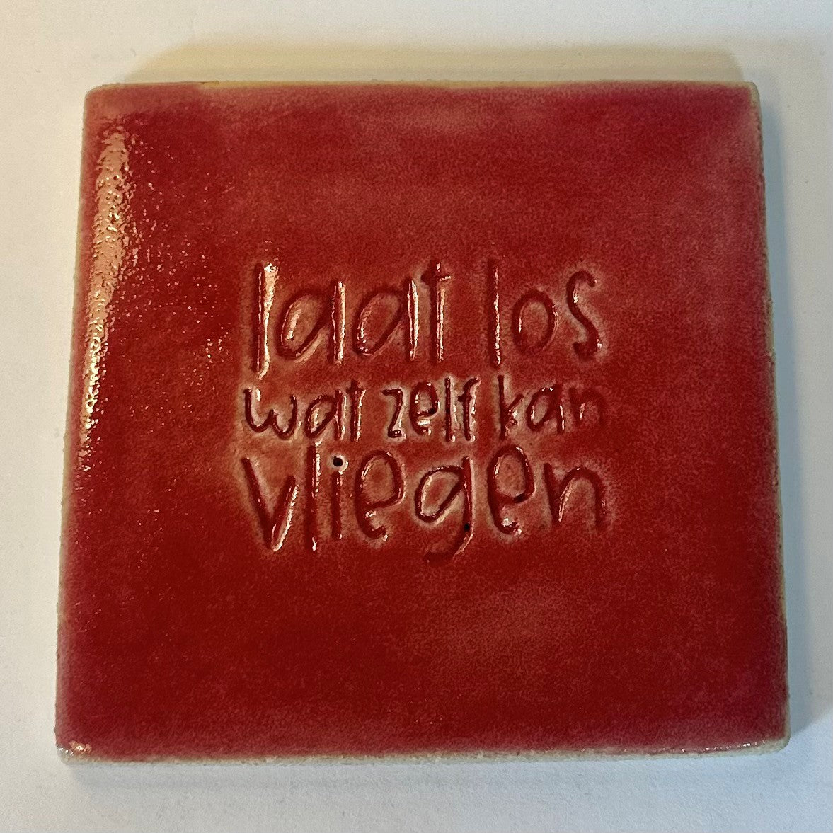 mooiewoordentegel laat los rood