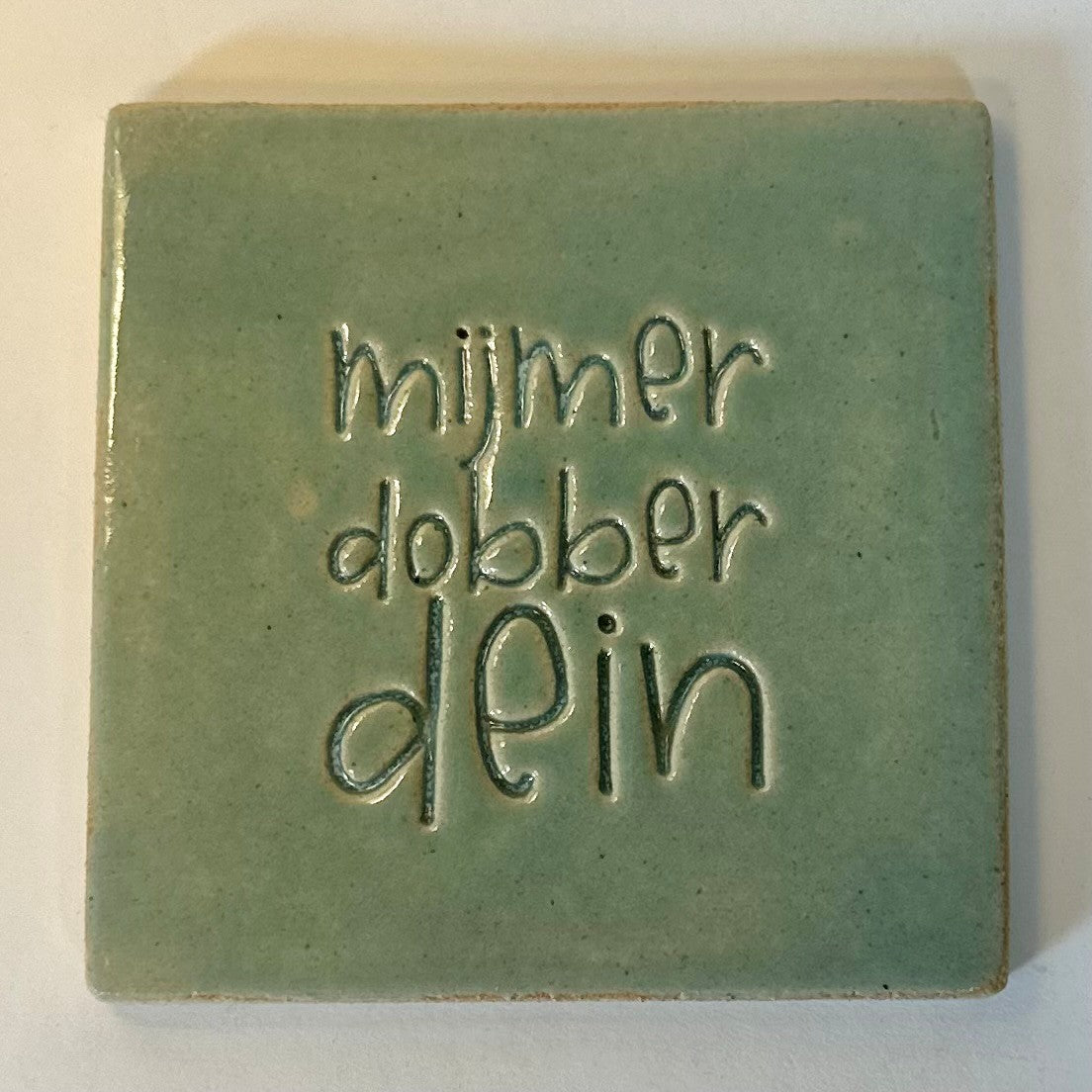 mooiewoordentegel mijmerdobberdeiner aquagroen
